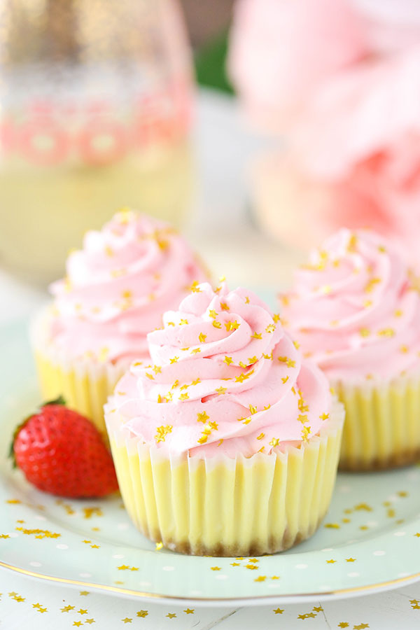 Mini Strawberry Champagne Cheesecakes - lots of champagne and strawberry flavor! Perfect for New Years Eve!