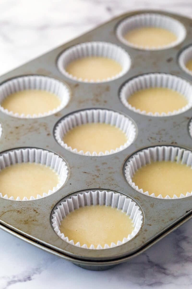 Vanilla cupcake batter in cupcake liners