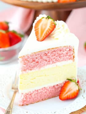 slice of Strawberries and Cream Cheesecake Cake