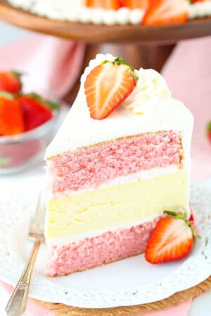 slice of Strawberries and Cream Cheesecake Cake
