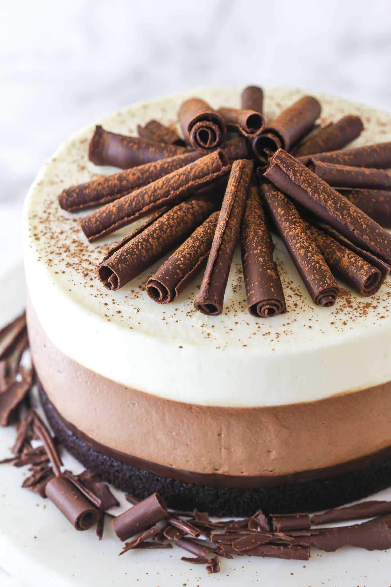 chocolate curls on top of triple chocolate mousse cake
