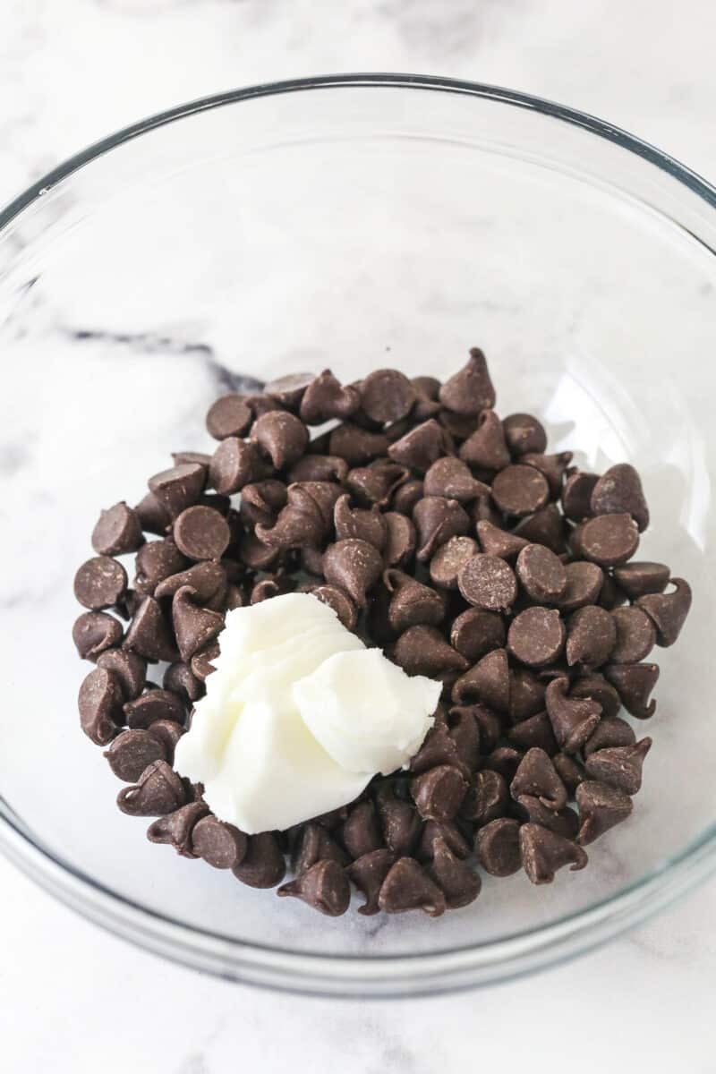 chocolate chips and shortening in a glass bowl