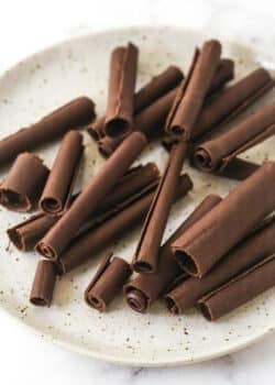 chocolate curls on a speckled plate