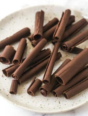 chocolate curls on a speckled plate