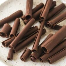 chocolate curls on a speckled plate