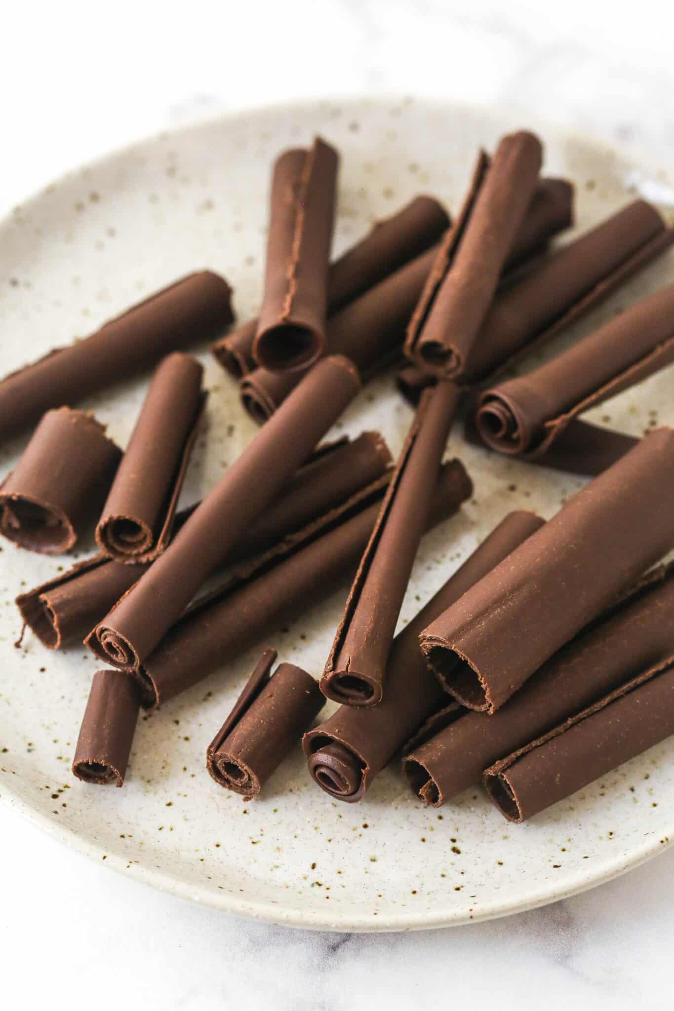chocolate curls on a speckled plate