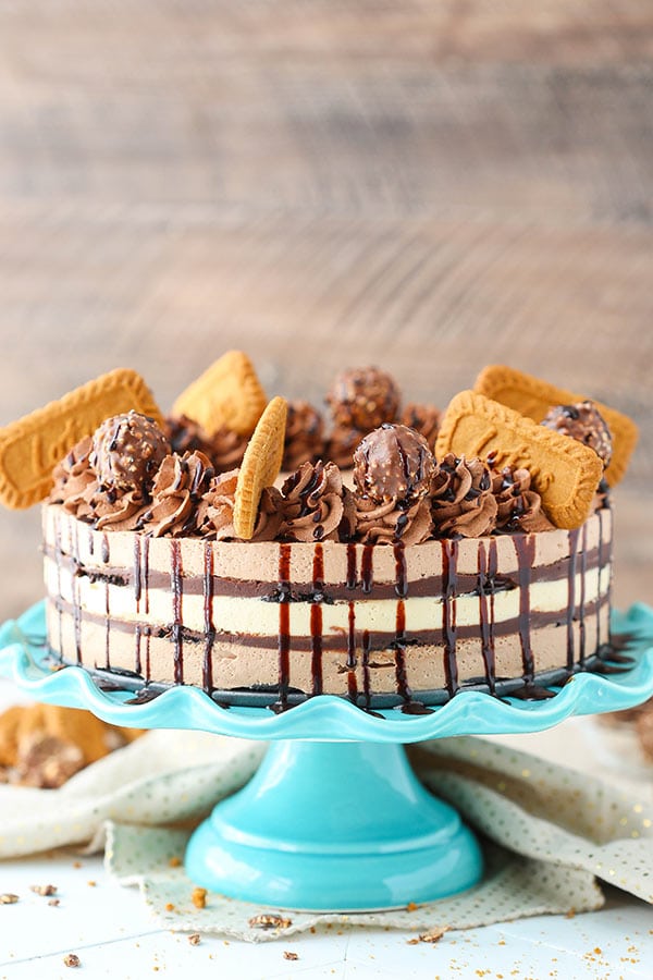 A whole Nutella Biscoff Icebox Cake on a frilly blue cake stand