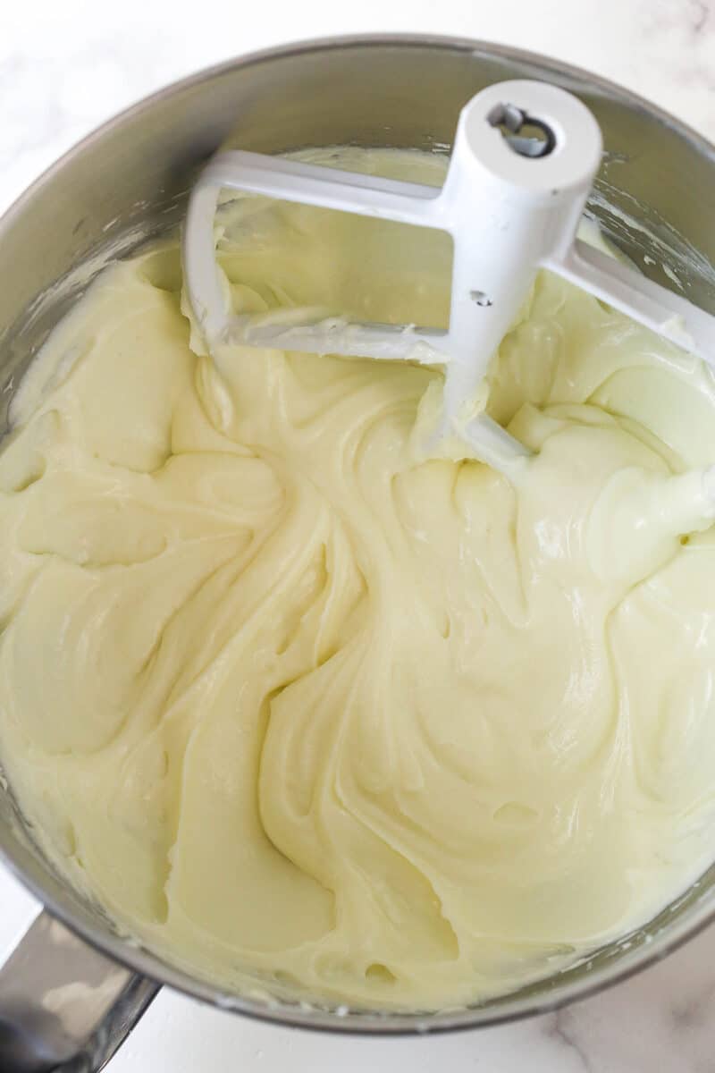 cream cheese, flour and sugar for cheesecake layer mixed in the bowl