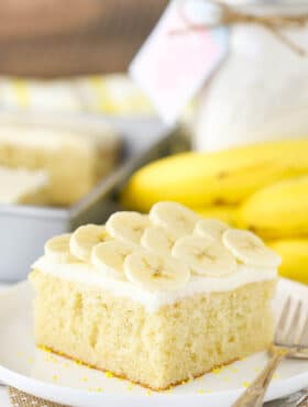 A Slice of Banana Cake with Cream Cheese Frosting on a Plate