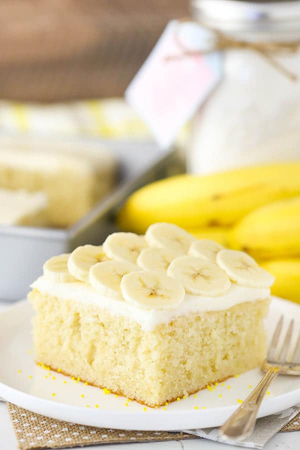 A Slice of Banana Cake with Cream Cheese Frosting on a Plate