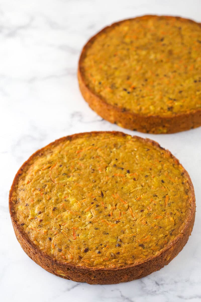 baked and cooled carrot cake layers on marble background