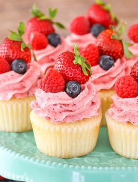 close up of Berries and Cream Cupcakes on cake stand