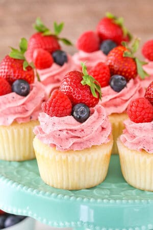 close up of Berries and Cream Cupcakes on cake stand