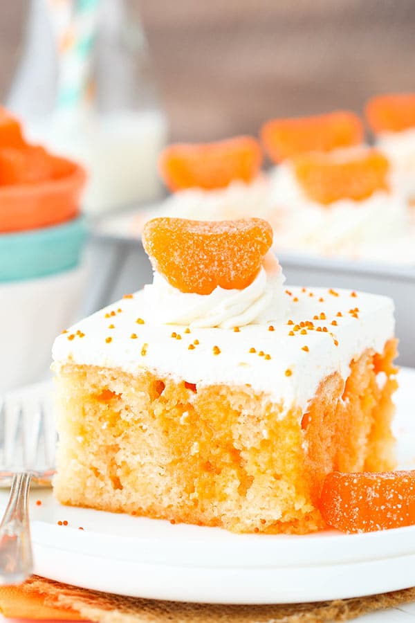 Image of a Piece of Orange Creamsicle Poke Cake