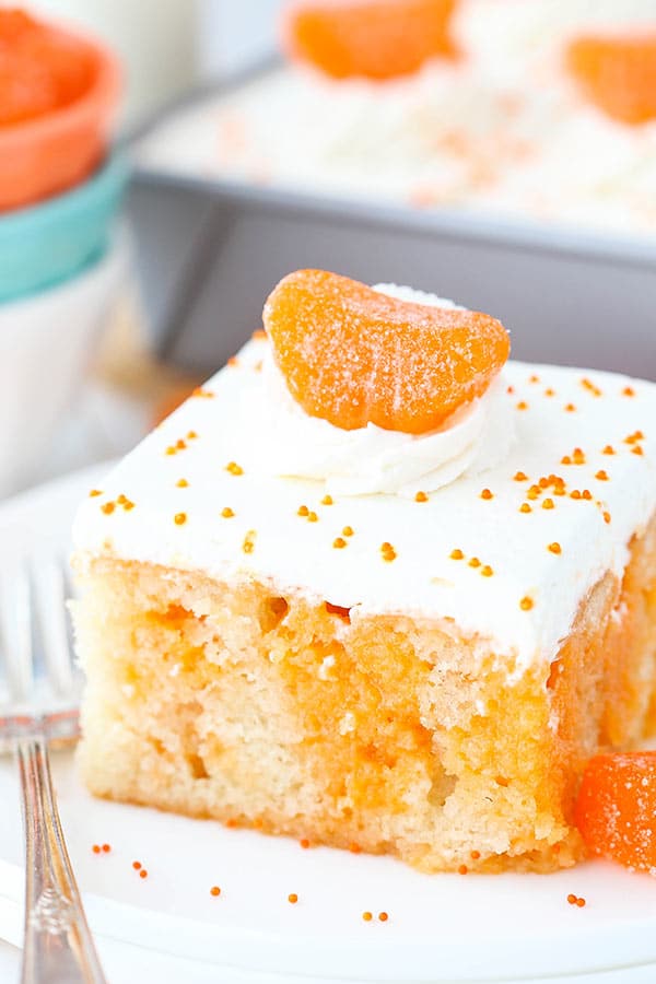 Close-up Image of a Slice of Orange Creamsicle Poke Cake