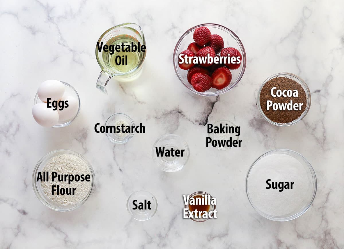Strawberry sauce is swirled on top of moist, cakey brownies, adding a pop of color and fresh fruit flavor in these strawberry brownies. Overhead view of ingredients needed to make strawberry brownies