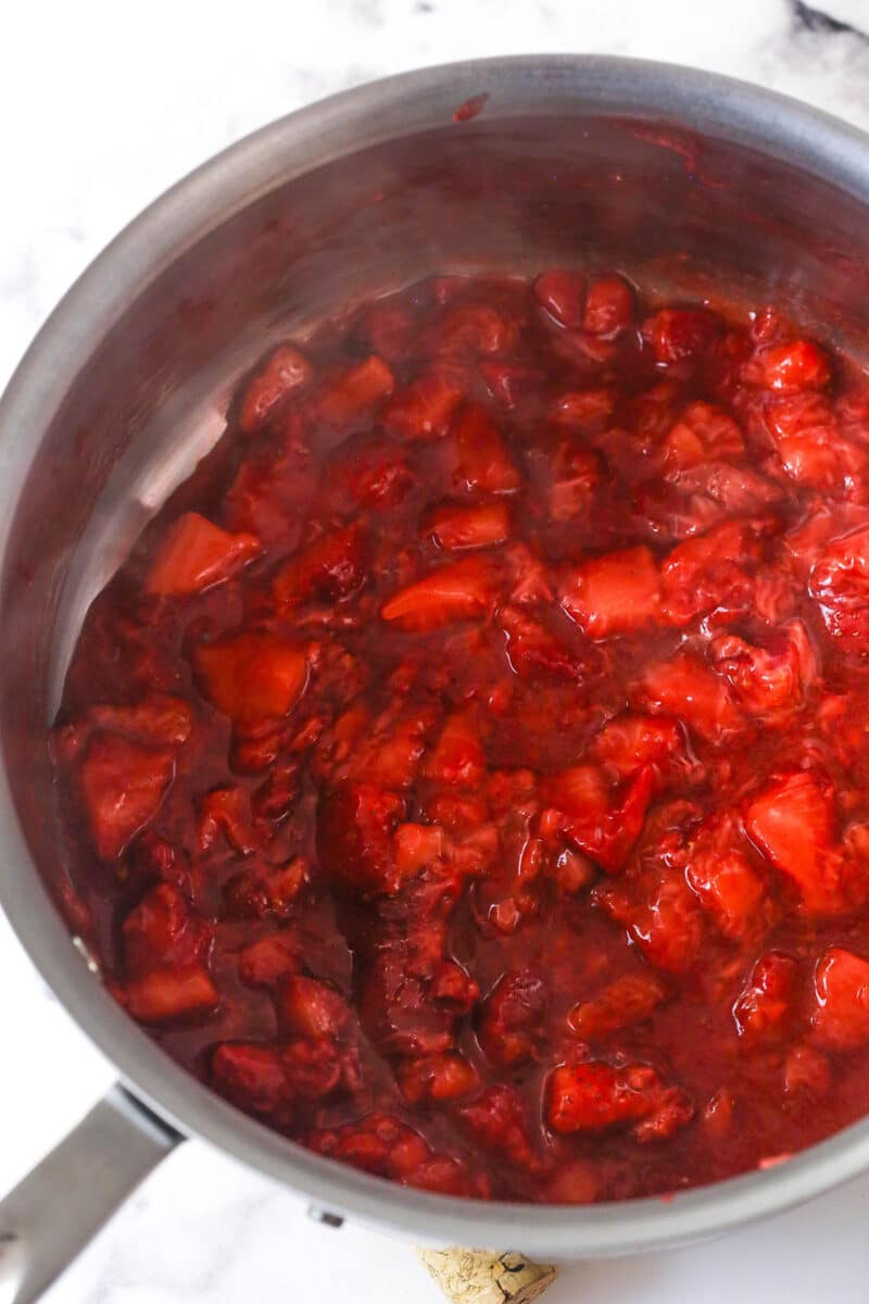 Strawberry sauce is swirled on top of moist, cakey brownies, adding a pop of color and fresh fruit flavor in these strawberry brownies. Cooked strawberries in a saucepan