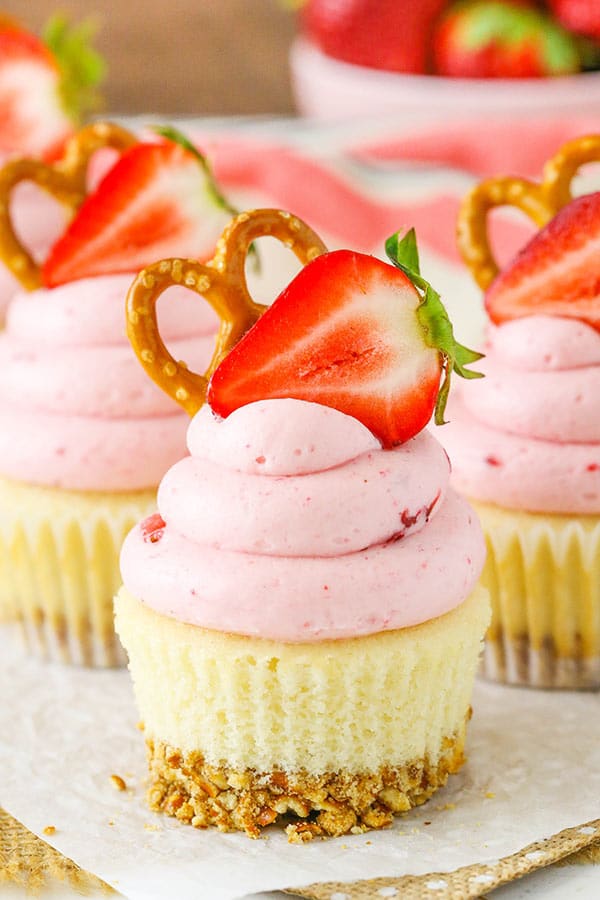 Strawberry Pretzel Salad Cupcakes topped with strawberries and pretzels