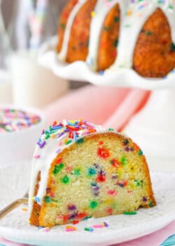 A big slice of Funfetti Cake on white plate