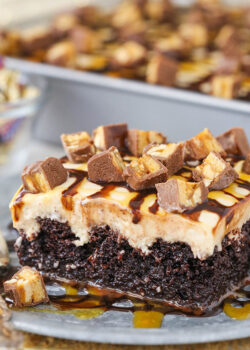 slice of Snickers Poke Cake