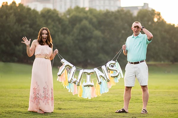 Lindsay and Ian hold twins sign