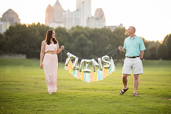 Lindsay and Ian with twins balloon banner