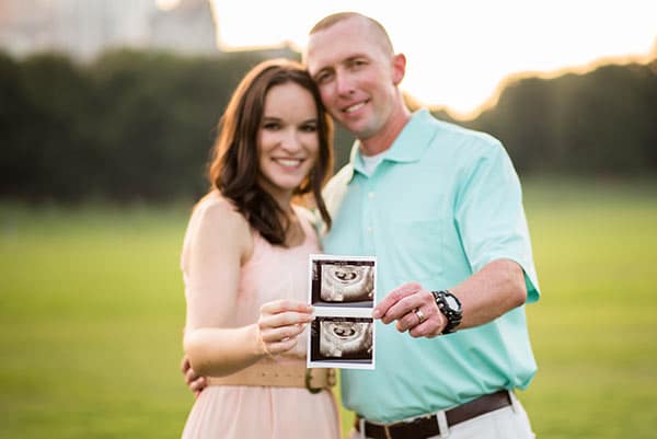 ultrasound picture of twins held by Lindsay & Ian