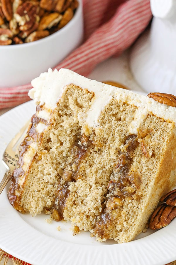Pecan Pie Layer Cake - layers of homemade pecan pie filling, moist brown sugar cake and cinnamon frosting!