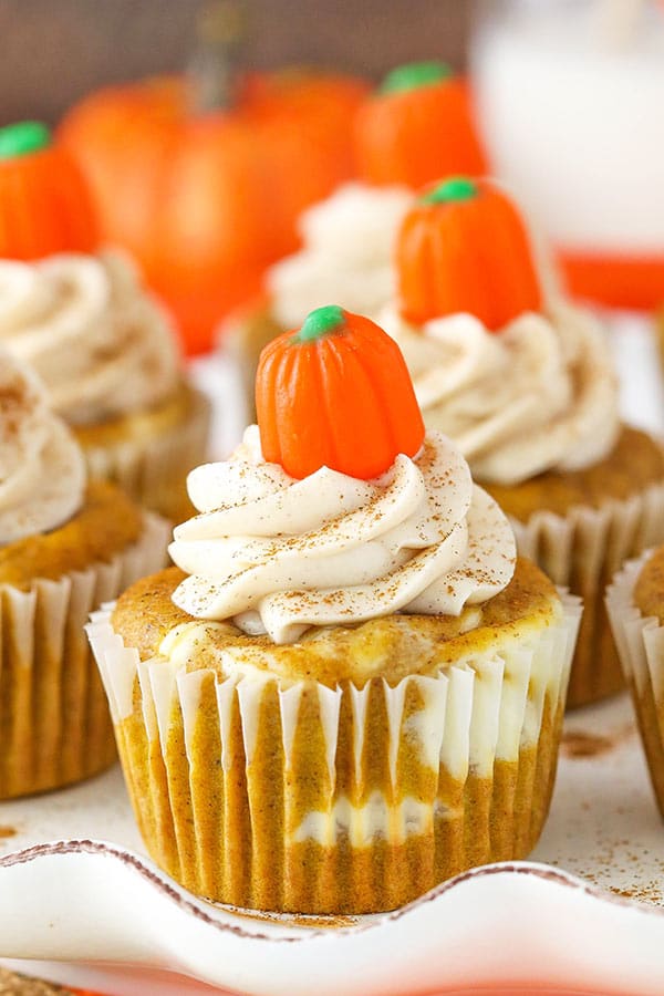 Pumpkin cheesecake cupcakes with cream cheese frosting.