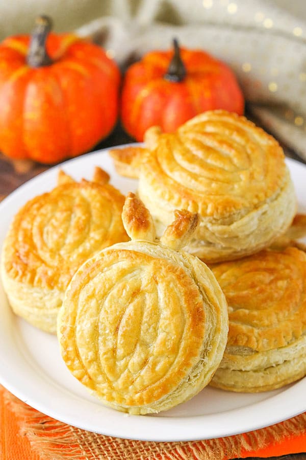 Image of Pumpkin Spice Pumpkin Pastries Stacked on a Plate