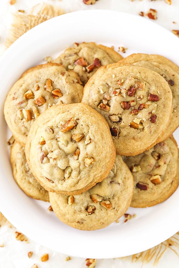 Top view of Butter Pecan Cookies stacked on a white plate