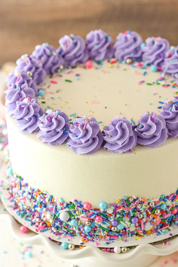 decorated Moist Vanilla Layer Cake angled view