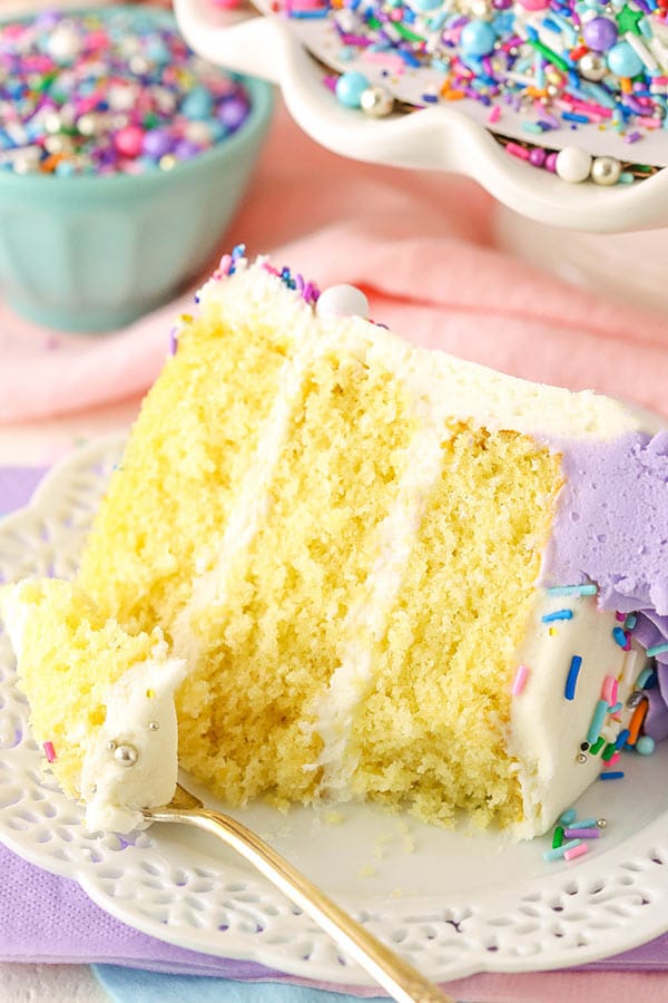 Slice of vanilla cake with a bite taken out