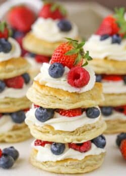 Close up of a mini berries and cream puff pastry cake.