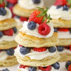 Close up of a mini berries and cream puff pastry cake.