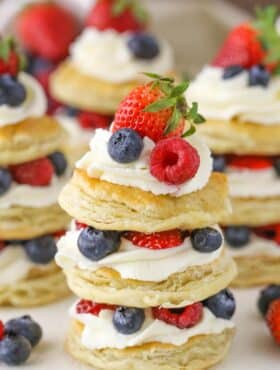 Close up of a mini berries and cream puff pastry cake.