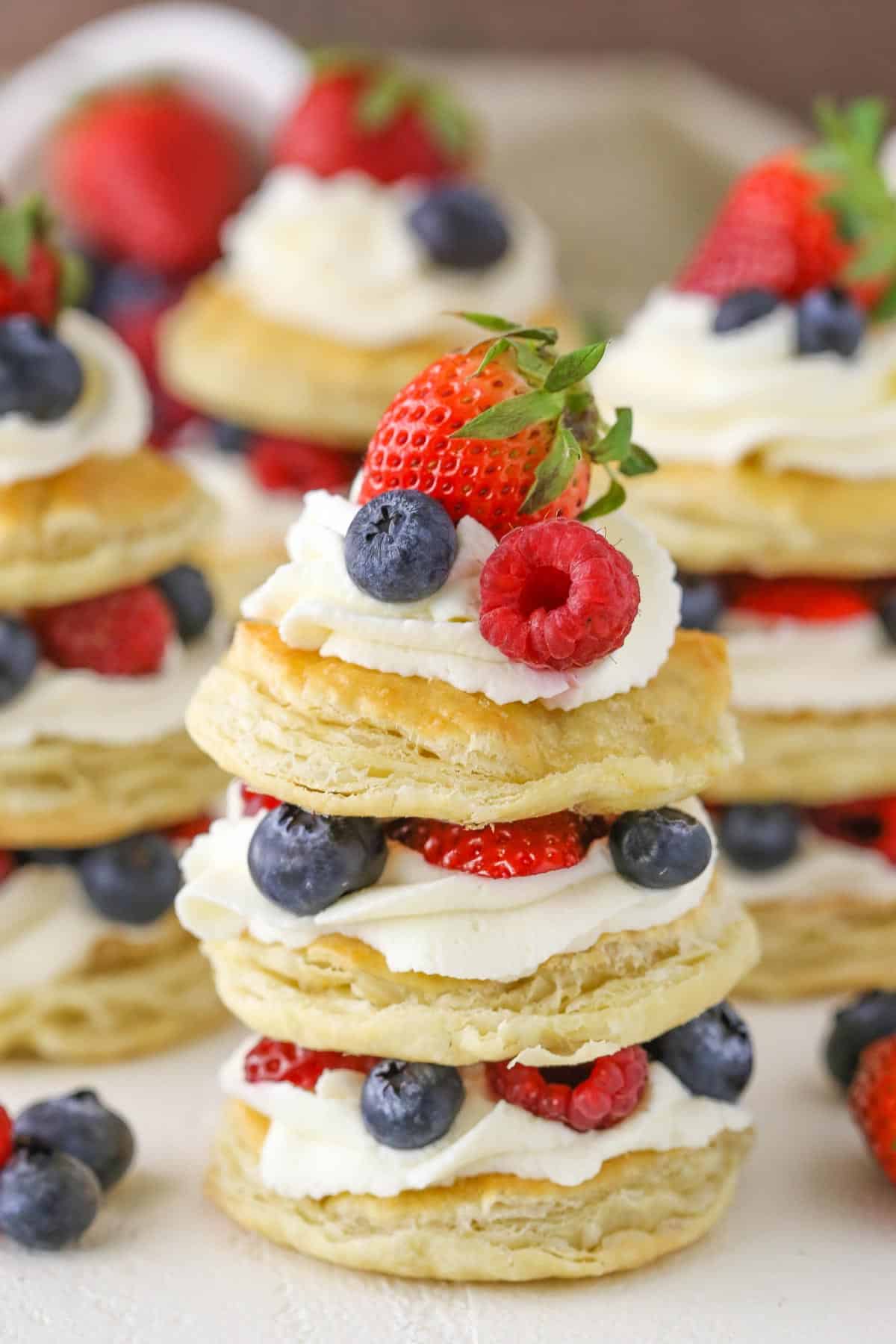 Close up of a mini berries and cream puff pastry cake.
