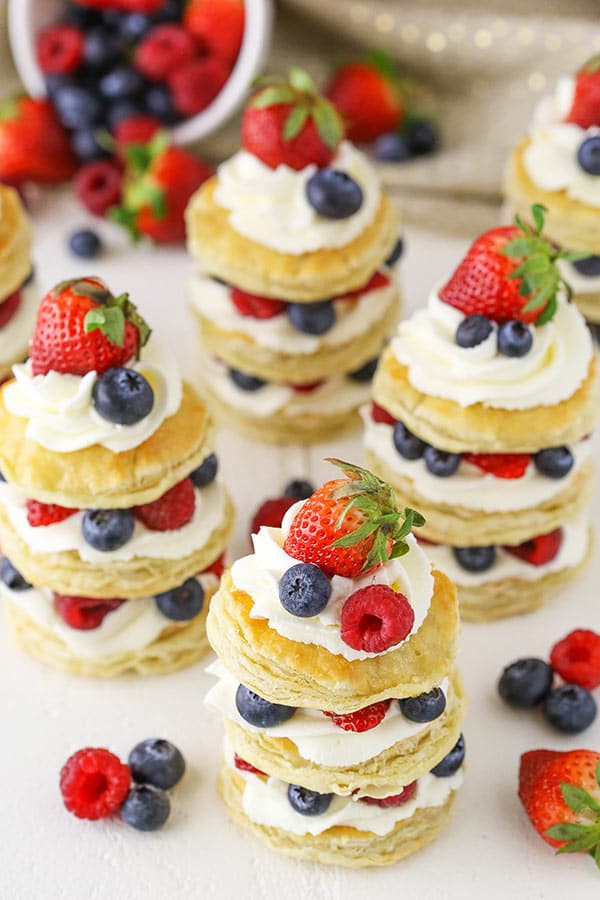 Individual Mini Puff Pastry Cakes with whipped cream and berries