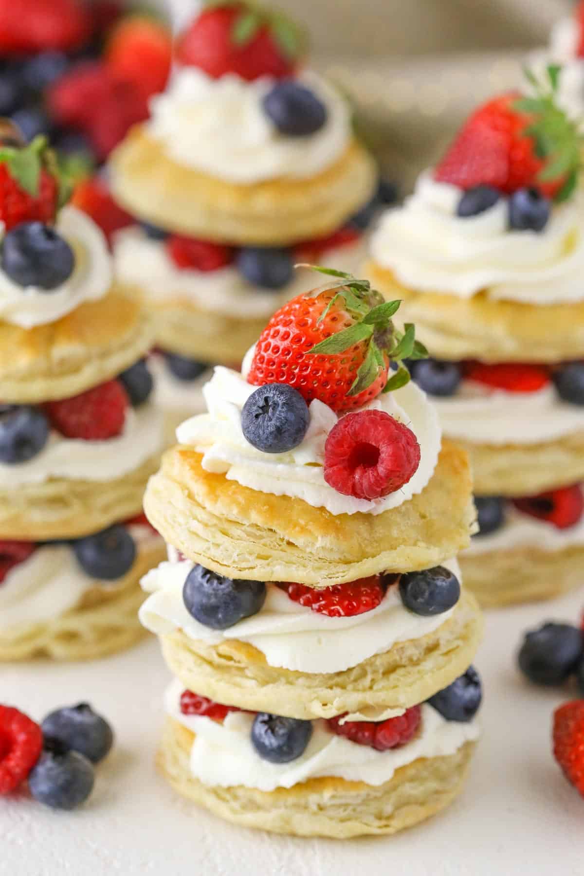 Close up of a mini berries and cream puff pastry cake. 