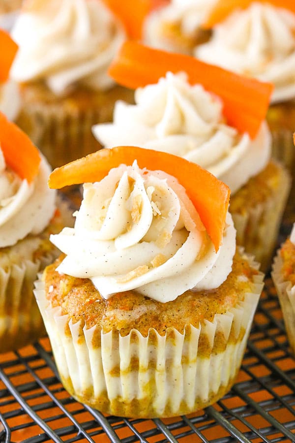 close up of decorated Carrot Cake Cheesecake Swirl Cupcakes