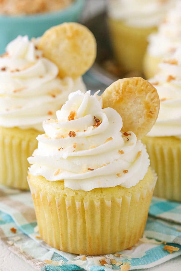 cupcakes with whipped cream and toasted coconut