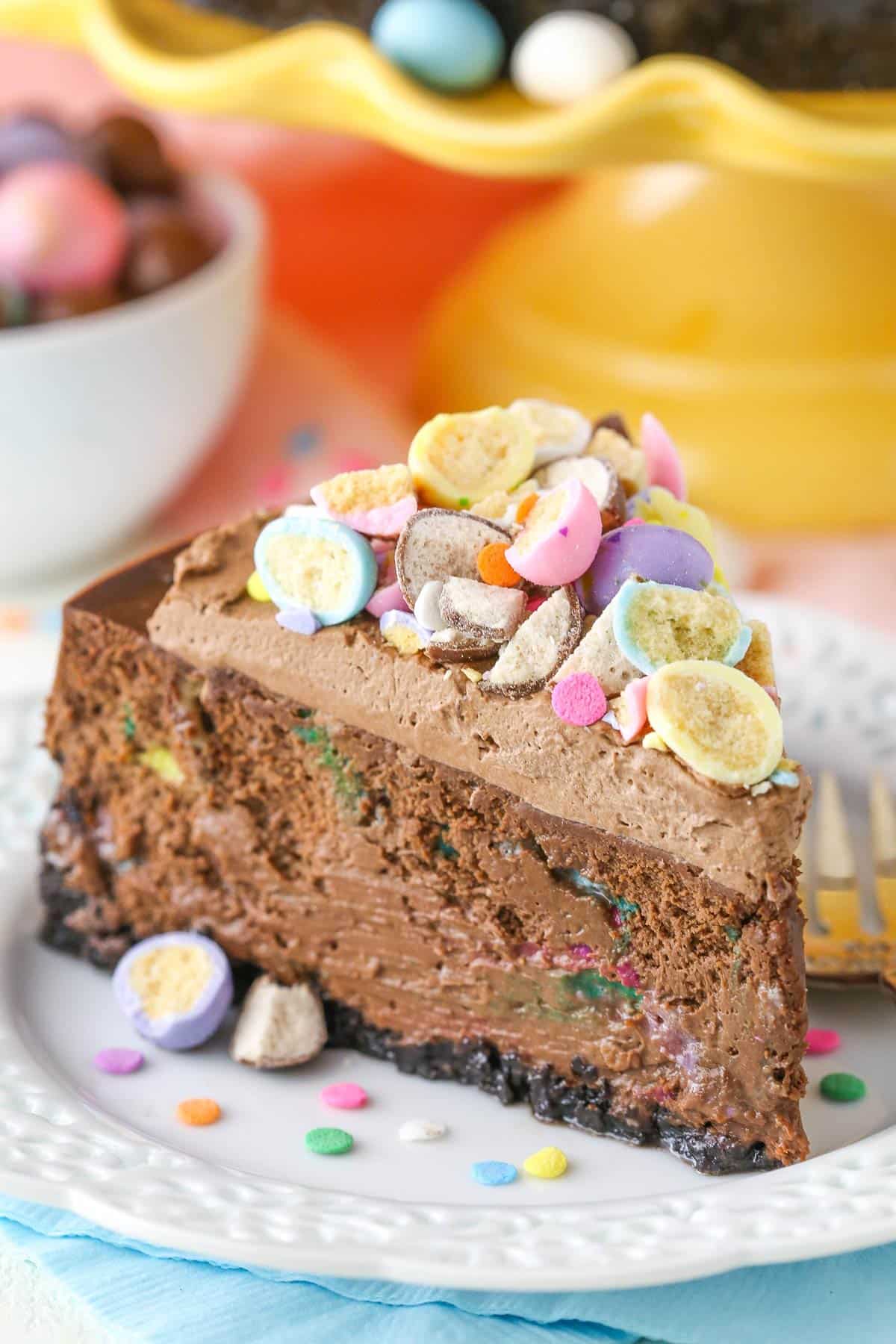 A slice of malted Easter egg cheesecake on a white dessert plate.