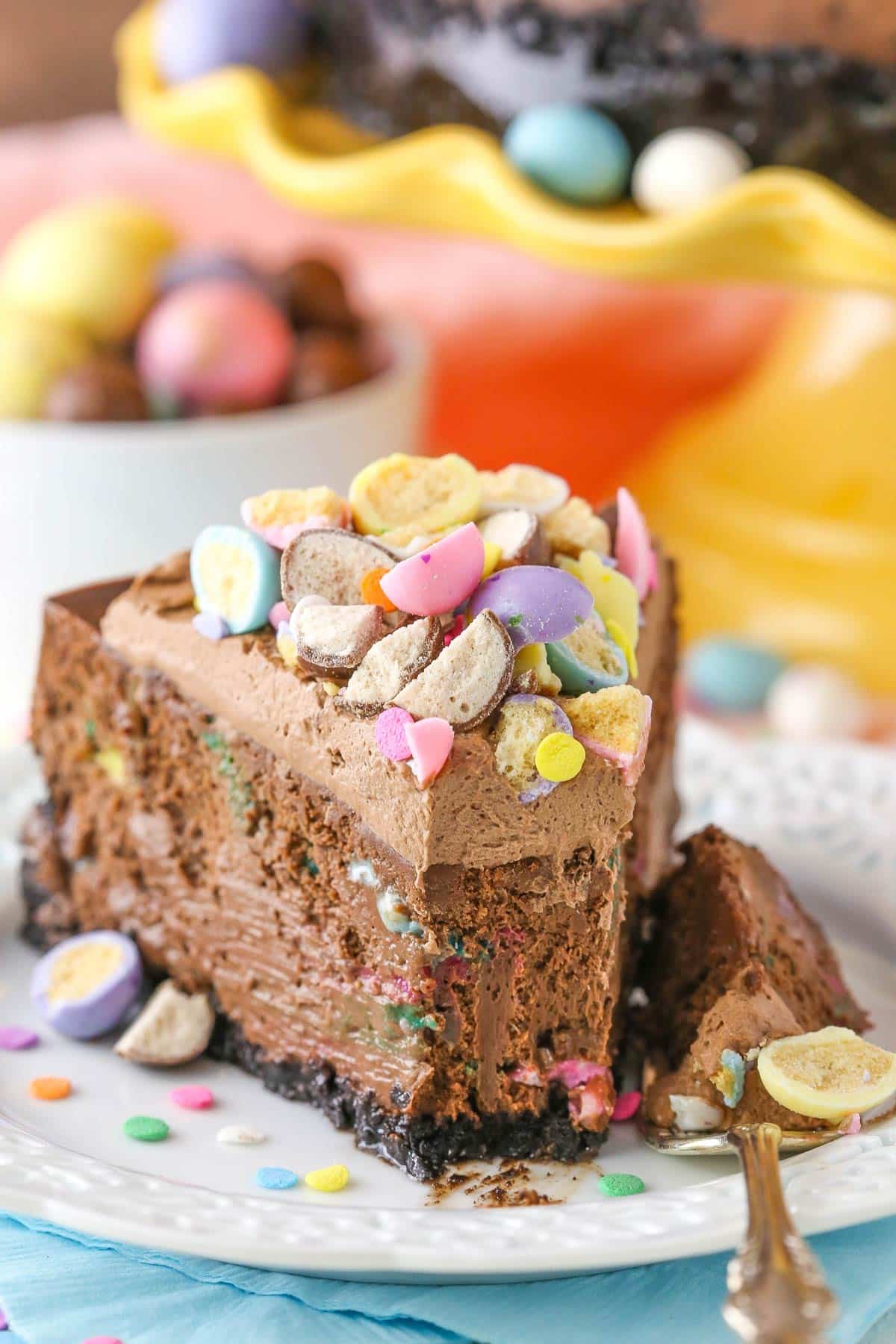 A slice of malted Easter egg cheesecake with a bite removed.