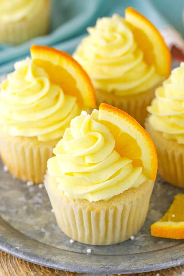 close up of decorated Orange Cream Cupcakes