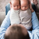 My Husband Holding Ashton and Brooks on His Lap While They're Swaddled