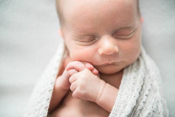 Baby Ashton Sleeping in an Off-White Blanket
