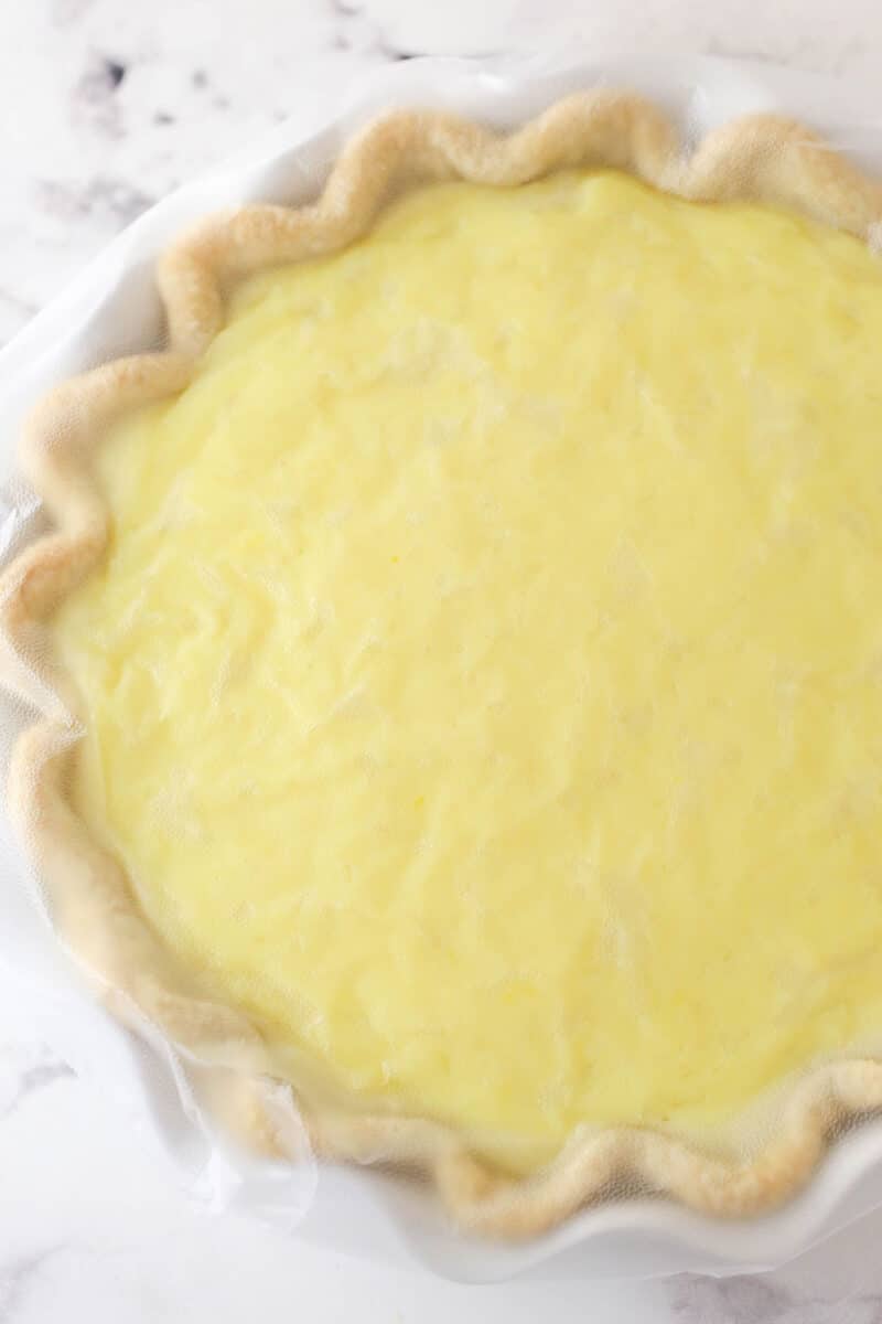 This coconut cream pie is a classic, creamy dessert made from rich coconut custard filling topped with whipped cream in a buttery pie crust. Coconut cream pie filling inside a flaky crust.