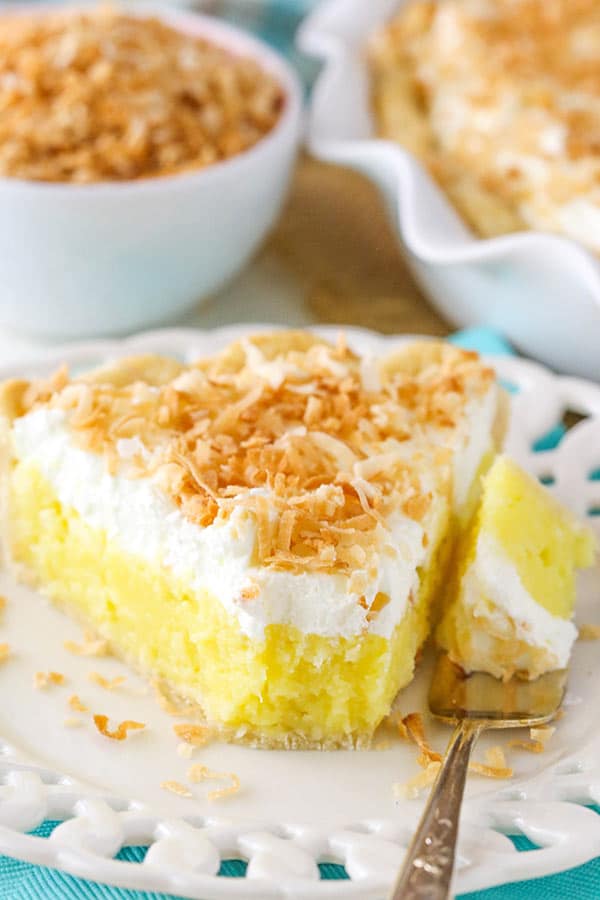 Classic Coconut Cream Pie slice with bite on fork