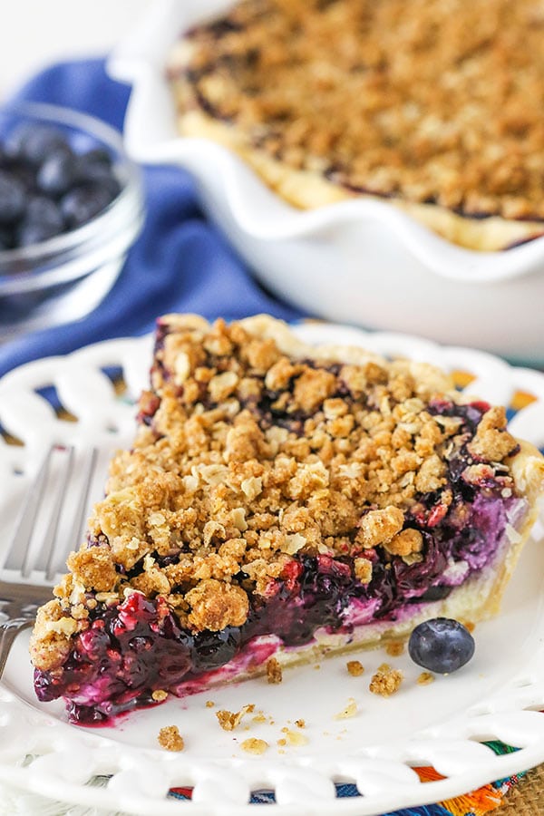 A slice of Cheesecake Pie on a white plate. 