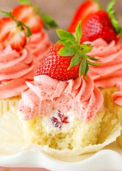image of Strawberries and Cream Cupcakes with bite taken out